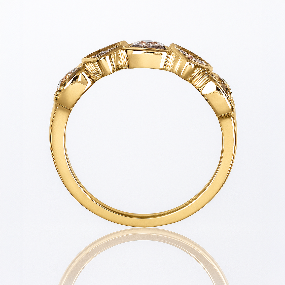 Gold ring with diamonds on a white background