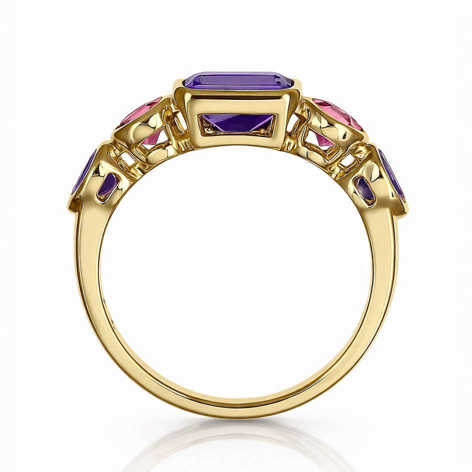 Gold ring with colorful gemstones on a white background