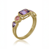 Gold ring with purple and pink gemstones on a white background