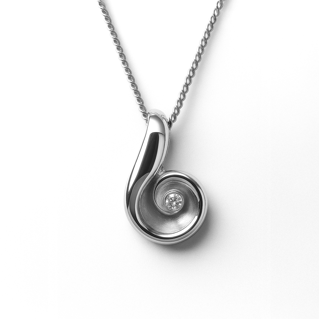 Silver pendant necklace with a diamond on a white background