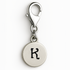 Silver charm with letter 'K' on a white background