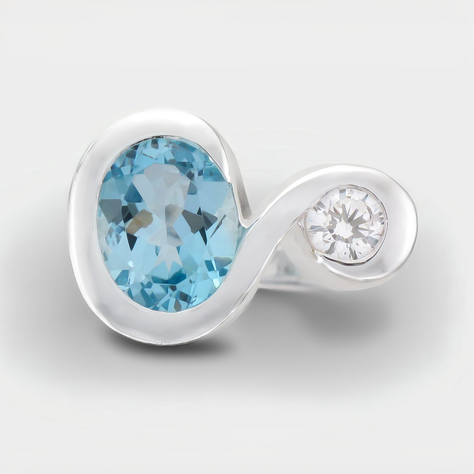 Silver Oval Blue Topaz and CZ Ring