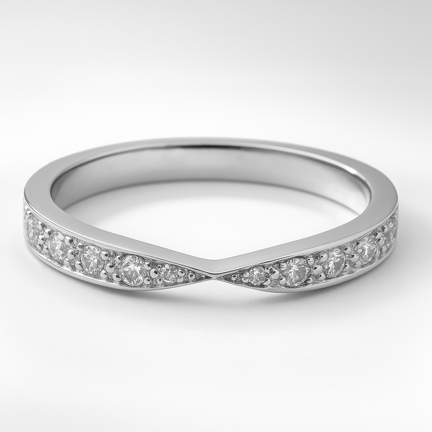 Platinum Twist Shaped Diamond Wedding Ring on a White Background