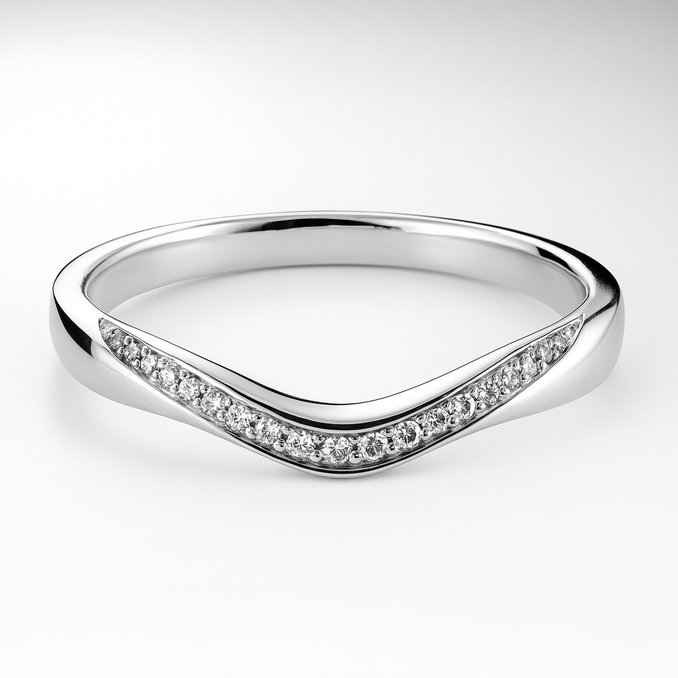 Platinum ring with diamond accents on a light background