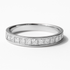 Platinum ring with princess-cut diamonds on a white background