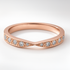 Rose Gold Twist Diamond Wedding Ring on a White Background