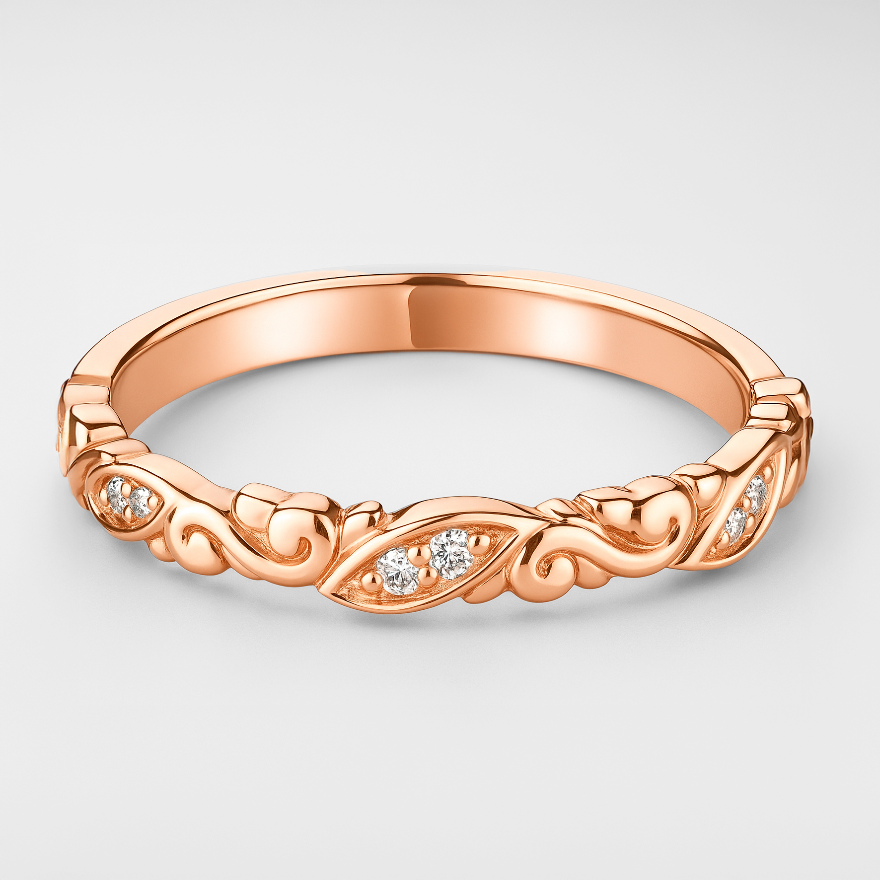 Rose Gold Scroll Detail Wedding Ring on a White Background