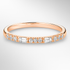 Rose Gold Round and Baguette Diamond Ring on a White Background