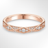 Rose Gold Geometric Pattern Diamond Wedding Ring on a White Background