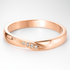 Rose Gold Wedding Ring with Diamond Accents on a White Background