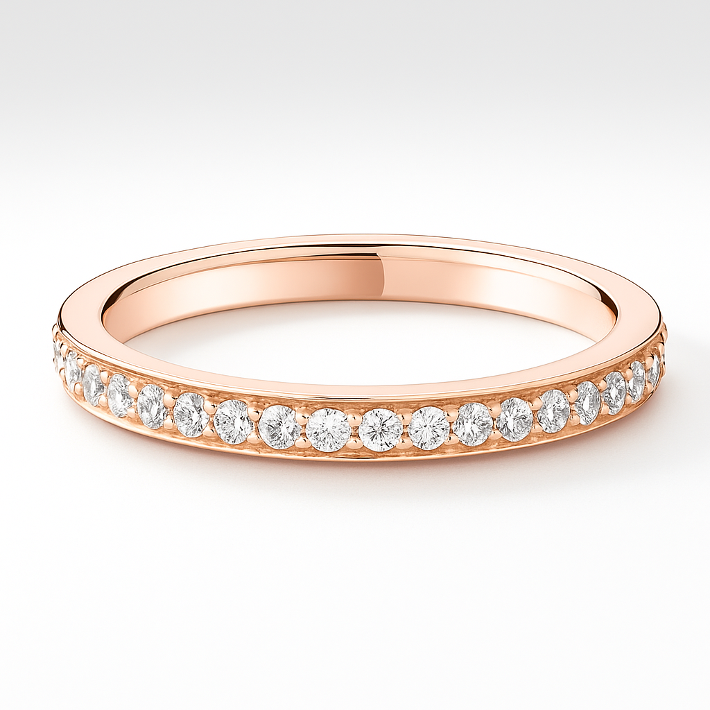 Rose gold ring with diamonds on a light grey background