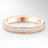 Rose gold ring with diamonds on a light grey background