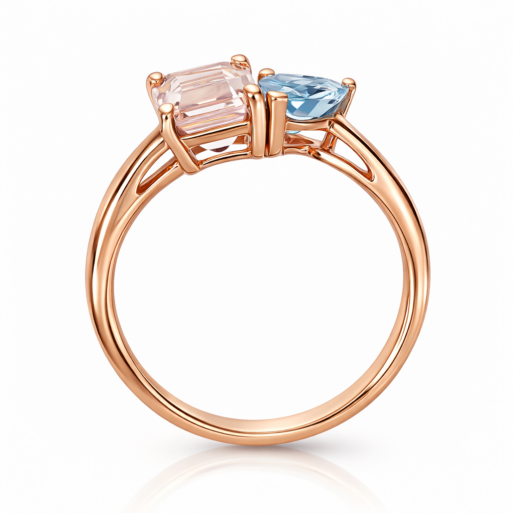 Rose gold ring with pink and blue gemstones on a white background