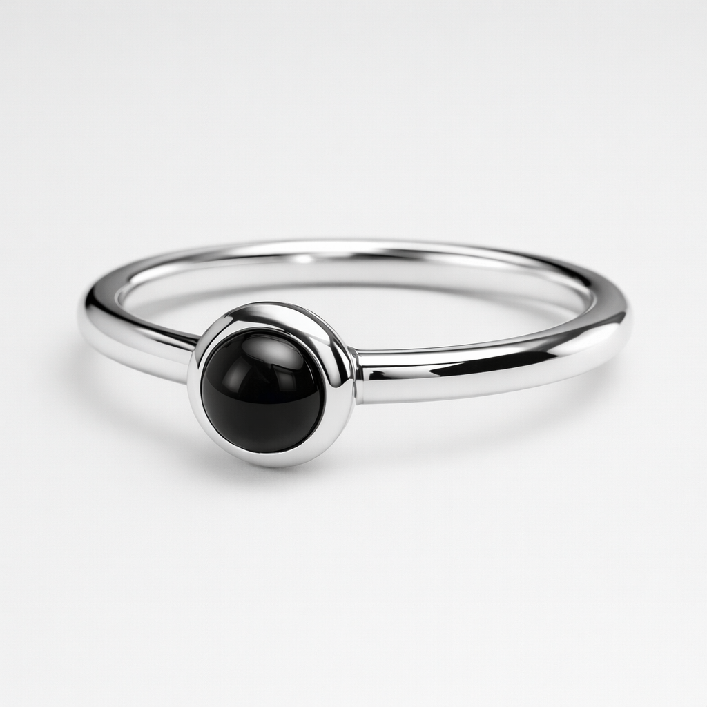 Silver Ring with a black stone on a white background