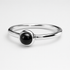 Silver Ring with a black stone on a white background