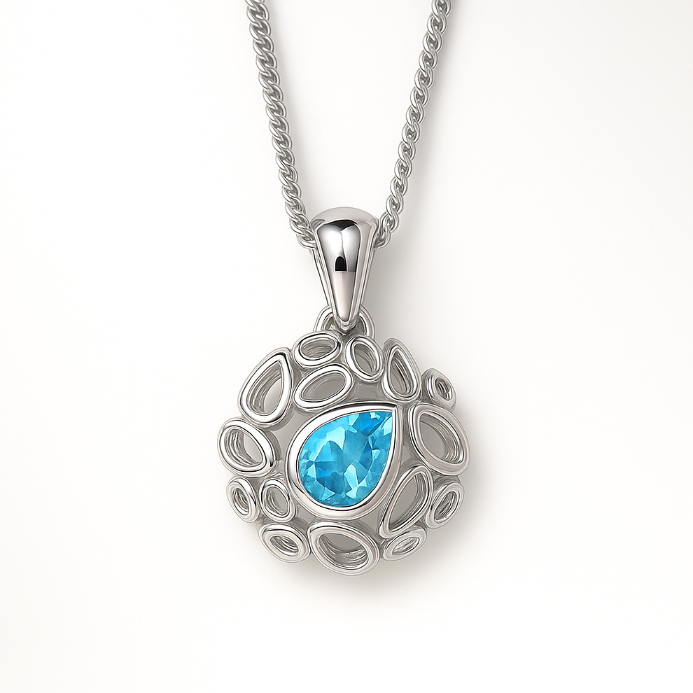 Silver pendant with a blue gemstone on a white background