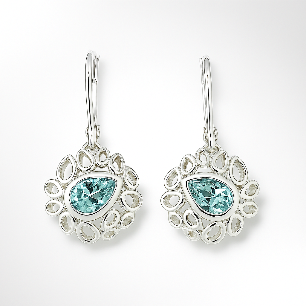 Pair of silver earrings with blue gemstones on a white background