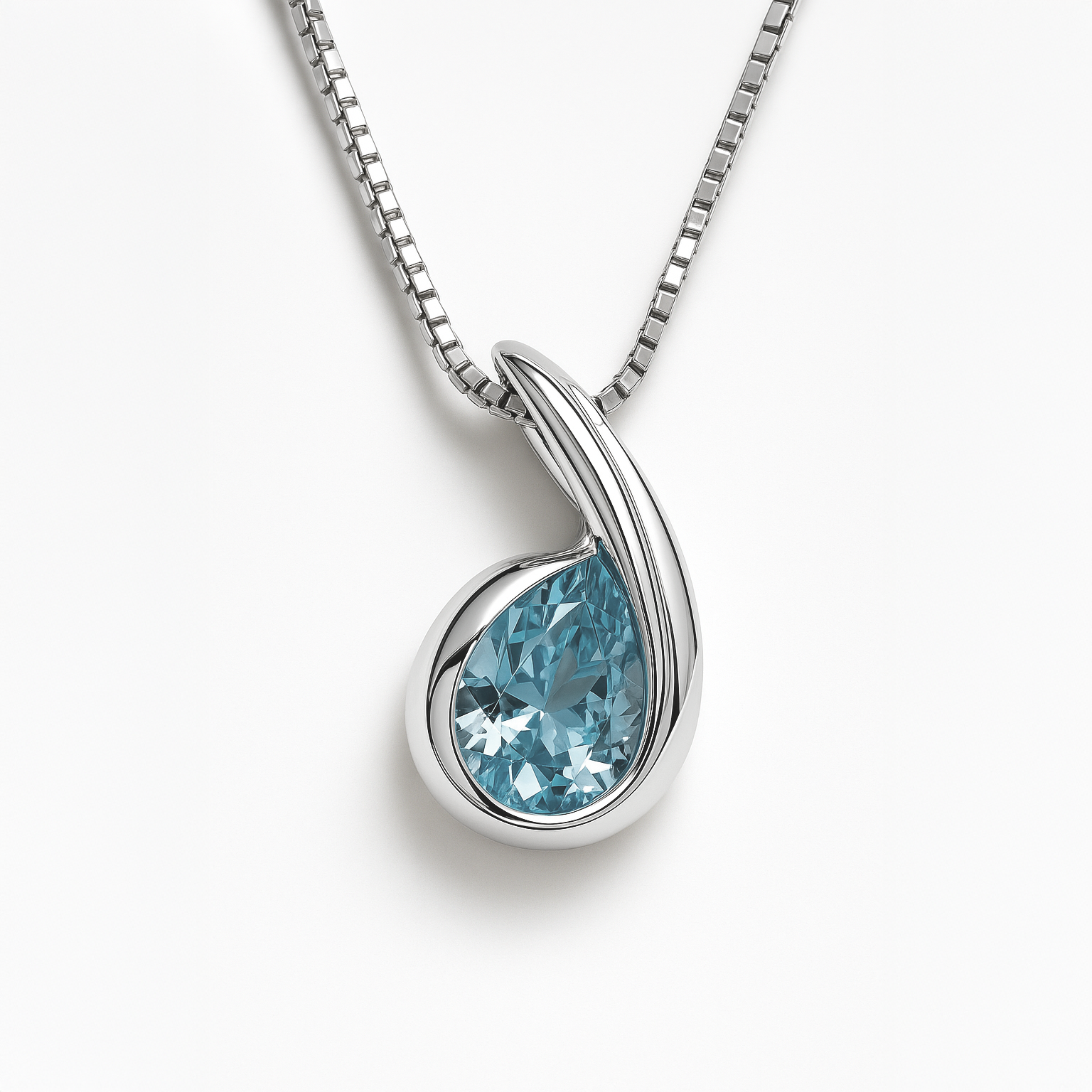 Silver pendant with a blue gemstone on a white background