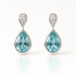Teardrop-shaped earrings with blue gemstones and silver accents on a white background