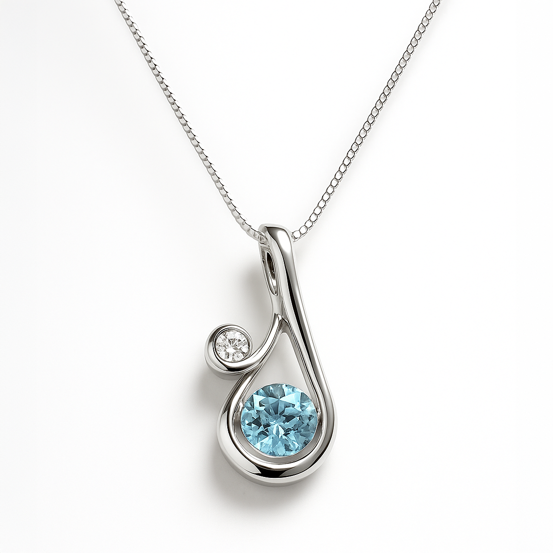 Silver pendant with a blue gemstone on a white background