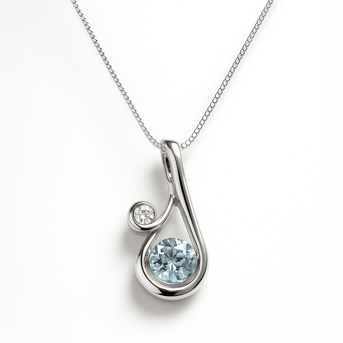 Silver pendant with a blue gemstone on a white background