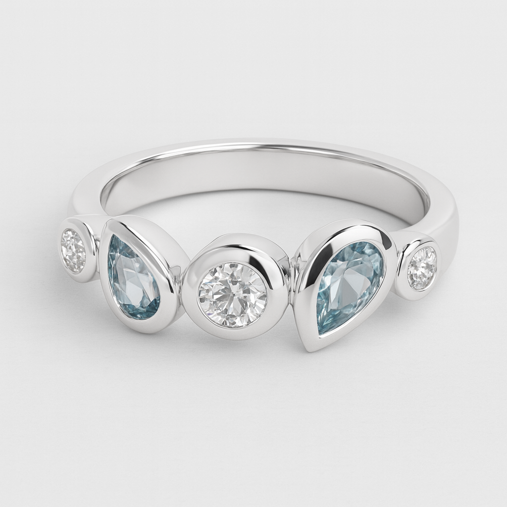 Silver ring with pear-shaped blue gemstones and round clear stones on a light grey background