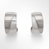 Pair of silver hoop earrings on a white background