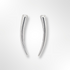 Pair of silver curved earrings on a light grey background