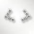 Pair of silver earrings with small diamonds on a light grey background