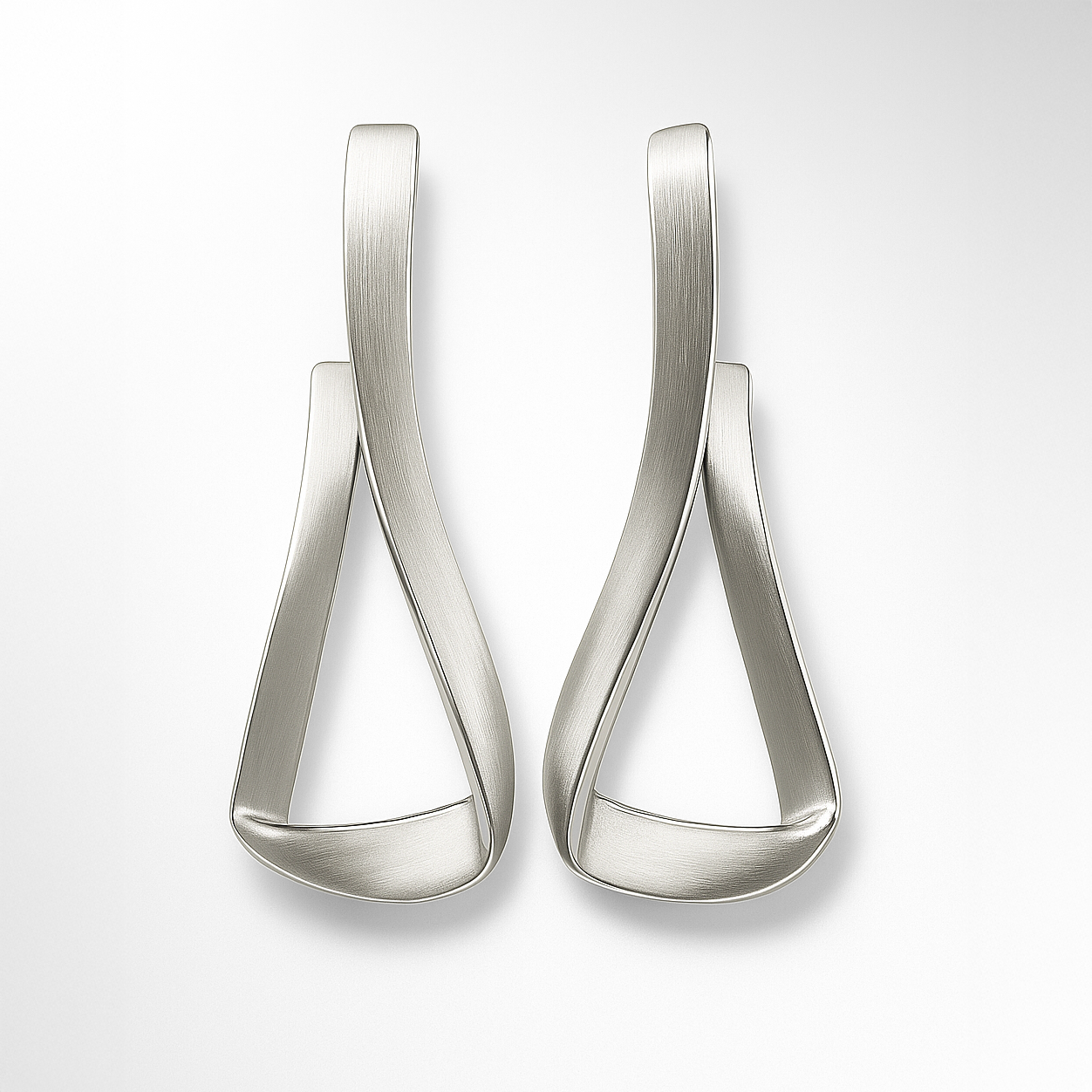 Pair of silver earrings on a white background