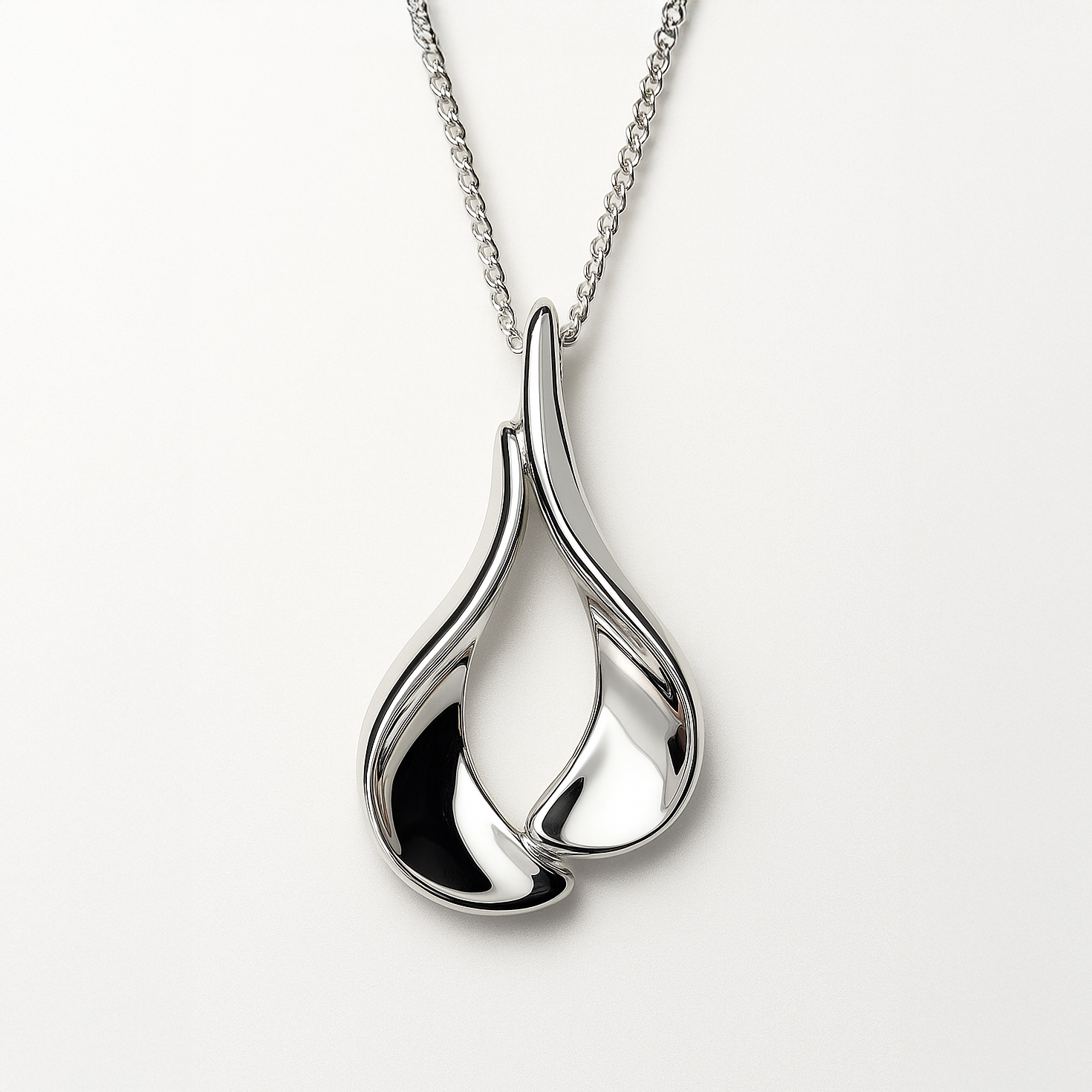 Silver pendant necklace on a white background