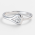 Silver ring with a clear  stone on a light grey background