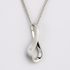 Silver infinity pendant necklace on a light grey background