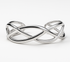 Silver Interwoven bangle on a white background