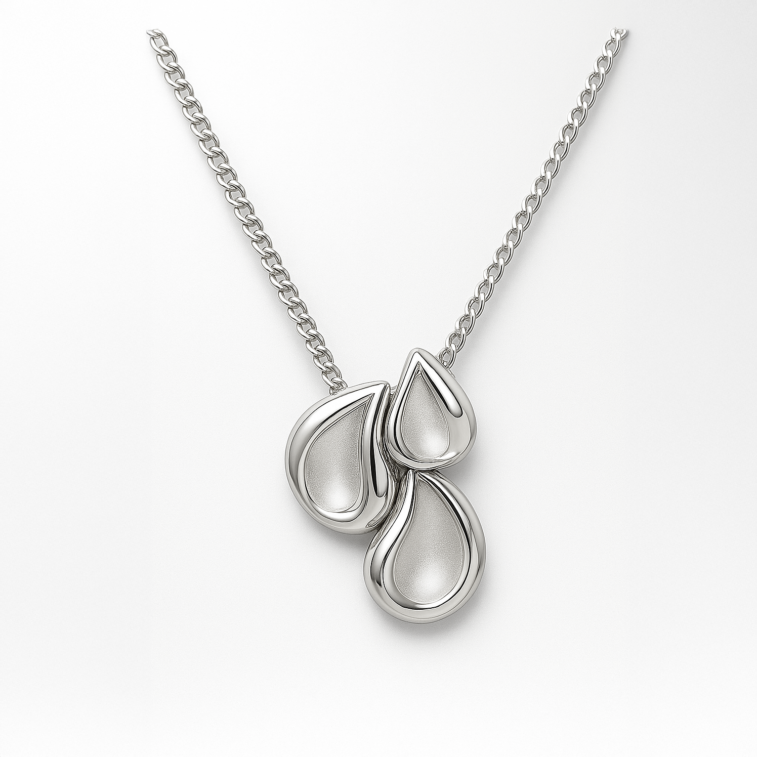 Silver necklace with three teardrop-shaped elements on a white background