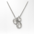 Silver necklace with three teardrop-shaped elements on a white background