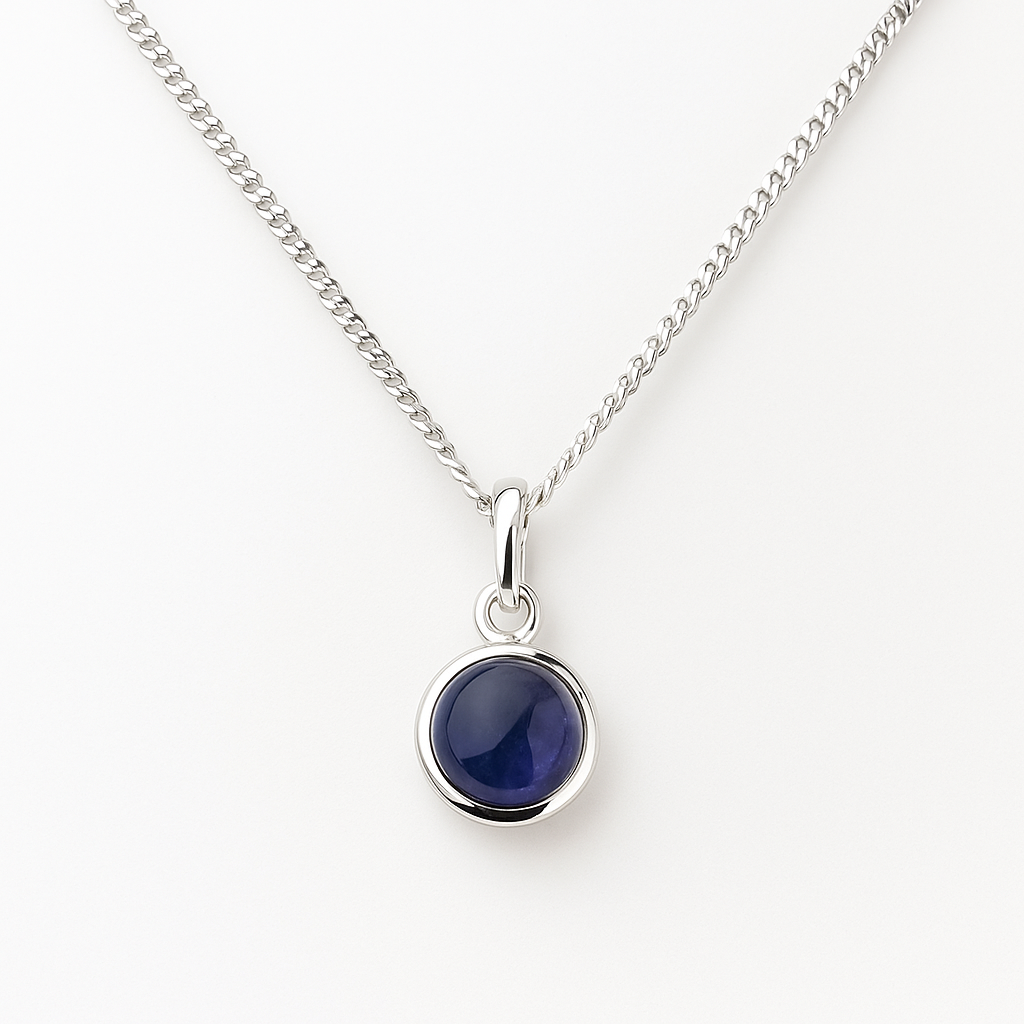 Silver necklace with a blue stone pendant on a white background