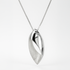 Silver pendant necklace on a light gray background