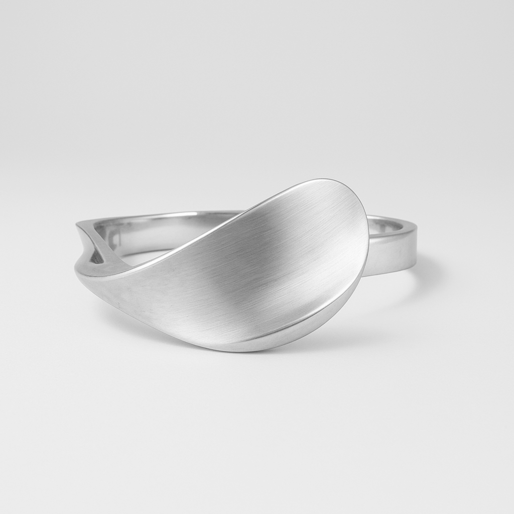 Silver ring with a modern design on a light grey background