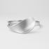 Silver ring with a modern design on a light grey background