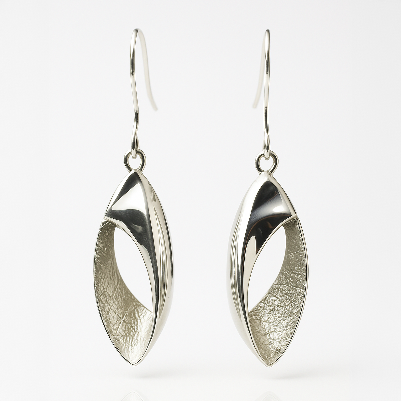 Pair of silver earrings on a white background