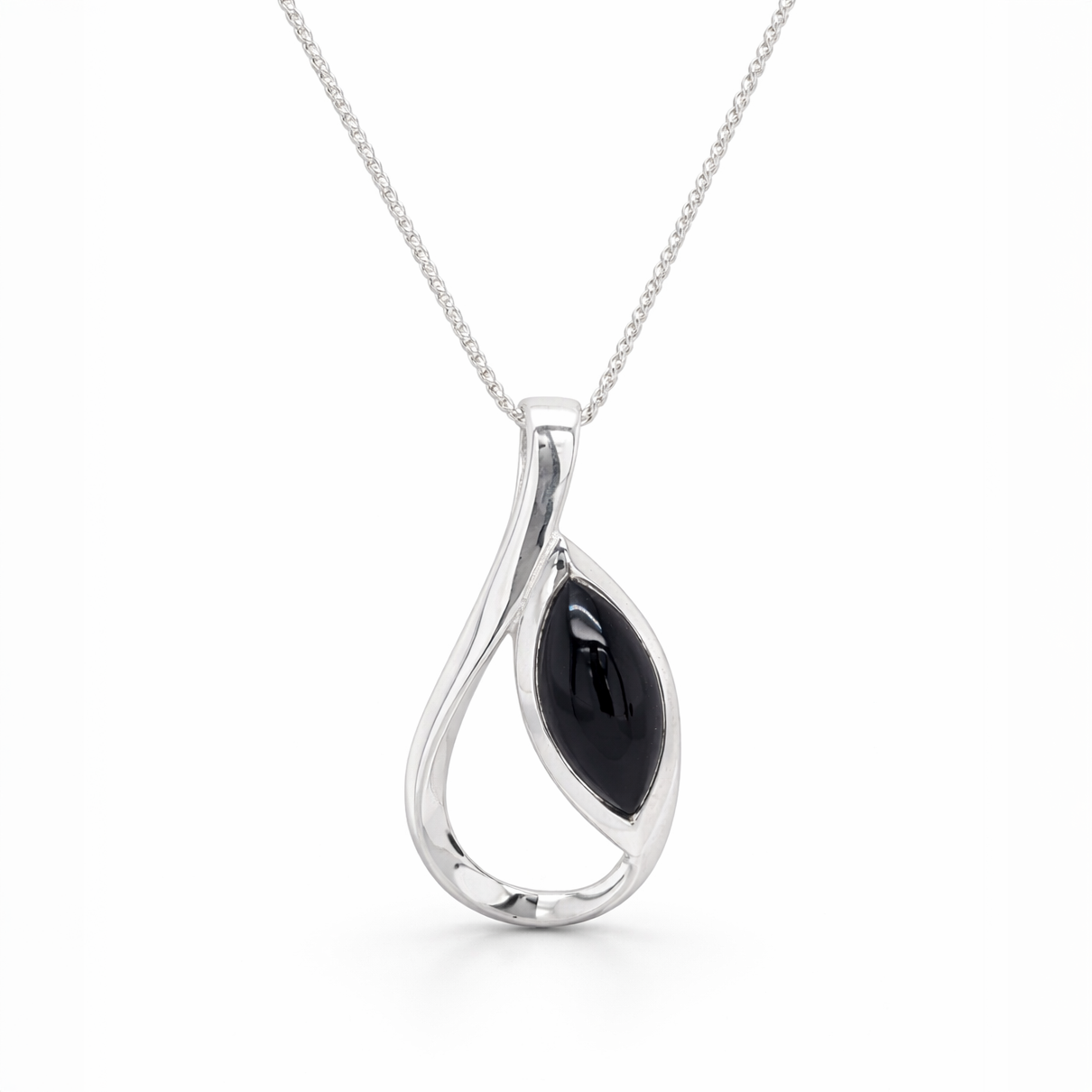 Silver pendant with a black stone on a white background