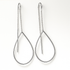 Teardrop-shaped silver earrings on a white background