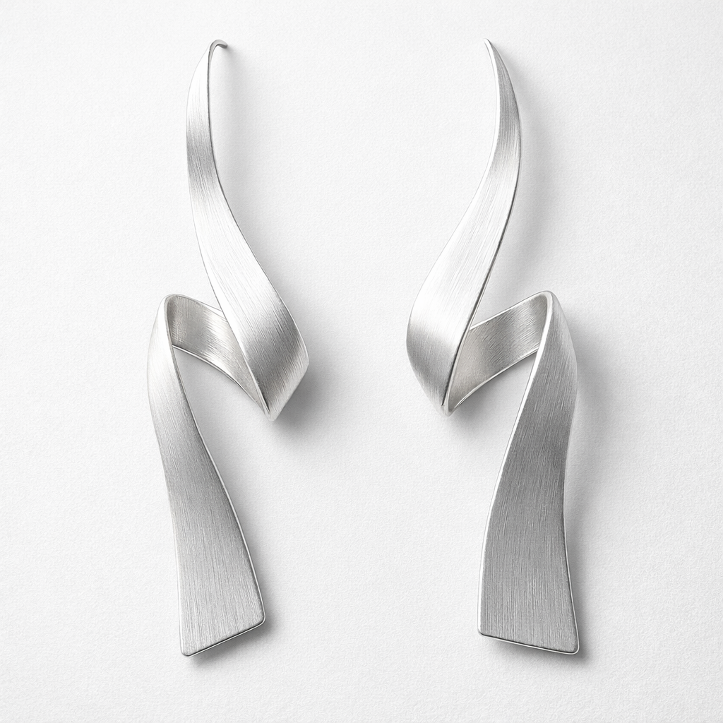 Pair of silver earrings on a white background