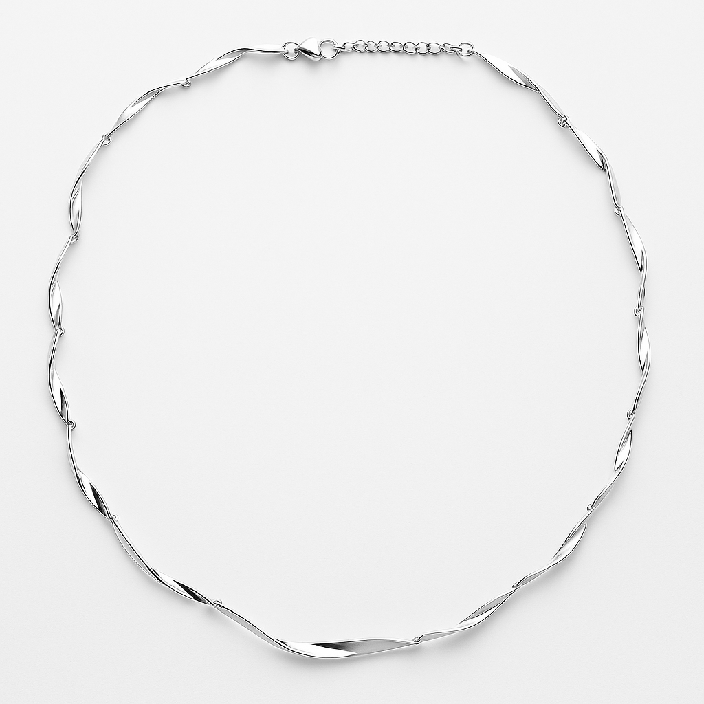 Silver necklace on a light grey background
