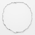 Silver necklace on a light grey background