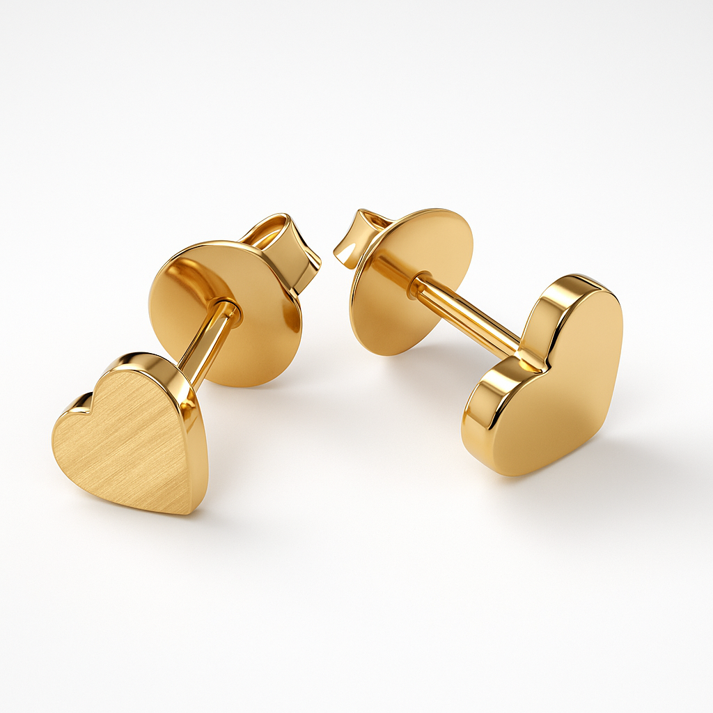 Gold heart-shaped earrings on a white background