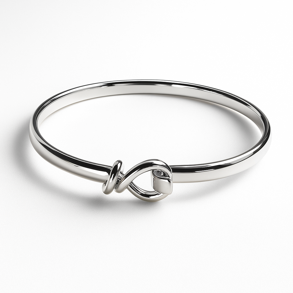Silver bracelet with a knot design on a white background