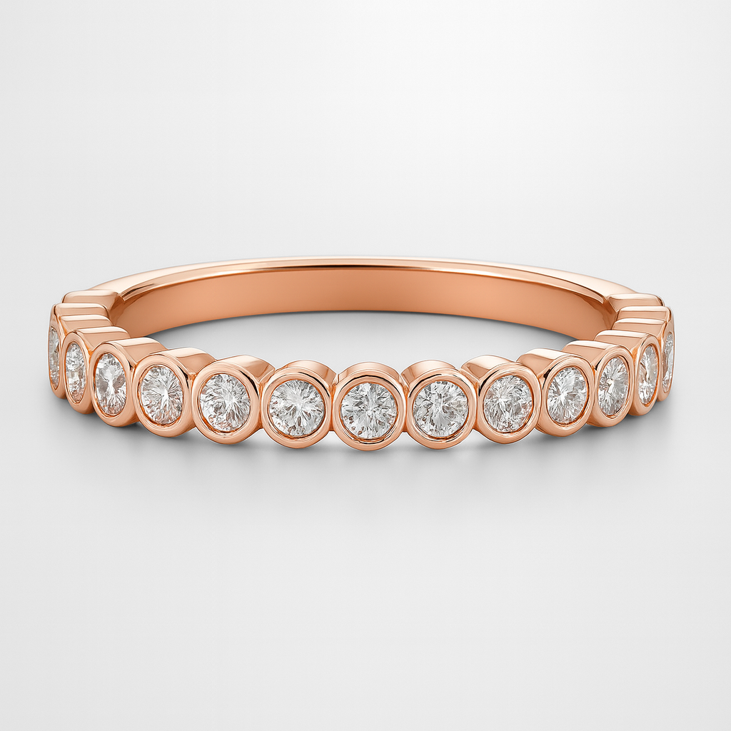 Rose gold wedding ring with diamonds on a light grey background