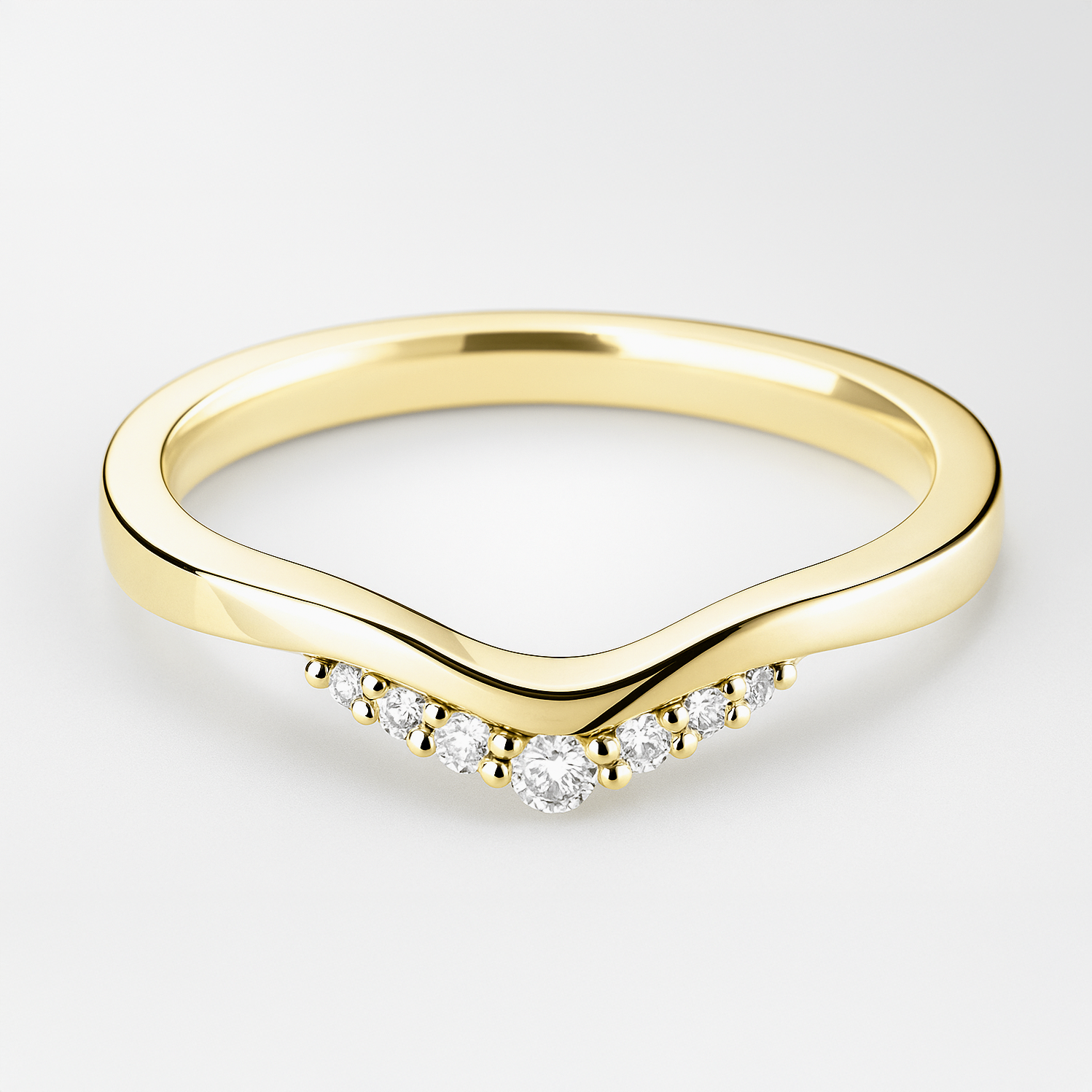 Yellow gold ring with diamond accents on a light background